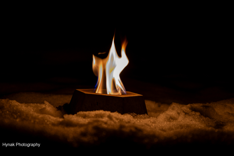 Chalice-flame-burining-in-snow-on-a-witer-night-1-of-1